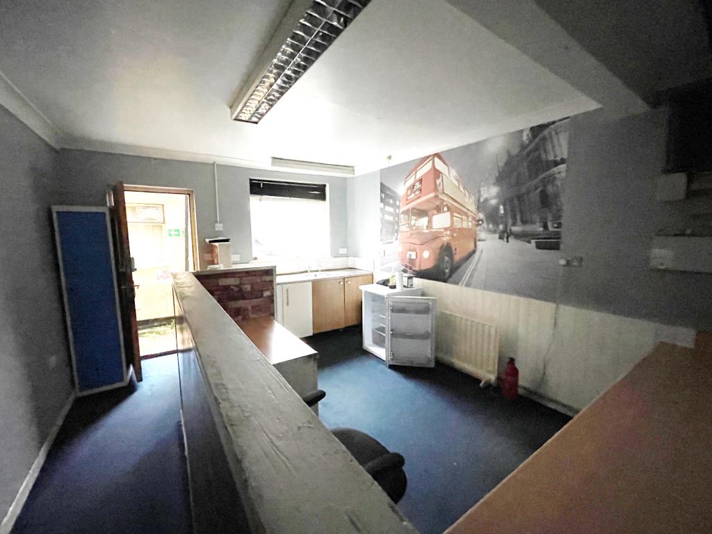 Lot: 64 - A MIX OF COMMERCIAL AND RESIDENTIAL PROPERTY FOR IMPROVEMENT IN CITY CENTRE - Rear office and staff area of old taxi office